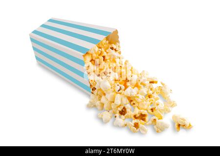 Tasty cheese popcorn falling out of a turquoise striped carton bucket, isolated on white background. Scattering of popcorn grains. Movies, cinema and Stock Photo