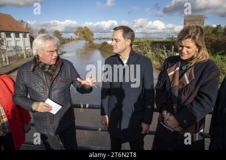 West-Flanders province governor Carl Decaluwe, Prime Minister Alexander De Croo and Interior Minister Annelies Verlinden pictured during a visit to a site of flooding in Poperinge, after days of heavy rain in the West Flanders province, Saturday 11 November 2023. BELGA PHOTO NICOLAS MAETERLINCK Stock Photo