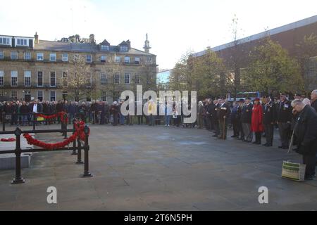 Newcastle Upon Tyne, UK. 11th Nov 2023. Armistice Day Remembered, Old Eldon Square War Memorial with Veterans and members of the public in attendance at 11am on 11 November. The Royal British Legion members with military vehicles selling poppies at Grey's Monument, Newcastle upon Tyne, UK, 11th Nov, 2023, Credit: DEW/Alamy Live News Stock Photo