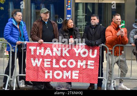 New York City, United States. 11th November, 2023. Spectators holding 'Thank You' sign in the Annual Veterans Day Parade along 5th Avenue in New York City. Credit: Ryan Rahman/Alamy Live News Stock Photo