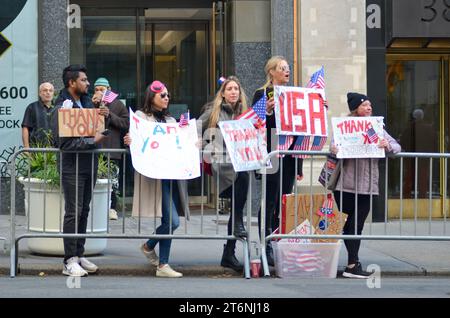 New York City, United States. 11th November, 2023. Spectators holding 'Thank You' signs in the Annual Veterans Day Parade along 5th Avenue in New York City. Credit: Ryan Rahman/Alamy Live News Stock Photo