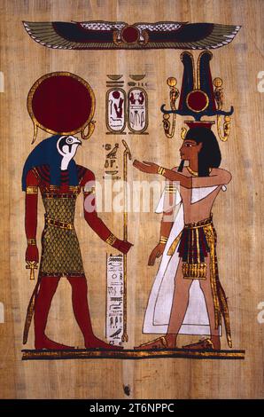 Egypt. Nile Delta. Handicraft. Painted papyrus with human & Falcon God (Horus) figures. Stock Photo