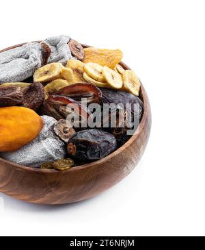 Dried  fruits in wooden bowl isolated on white Stock Photo