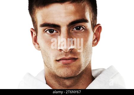 Portrait, serious and man in hoodie for fashion isolated on a white background. Confident young person, face of model and stylish clothes, casual and Stock Photo