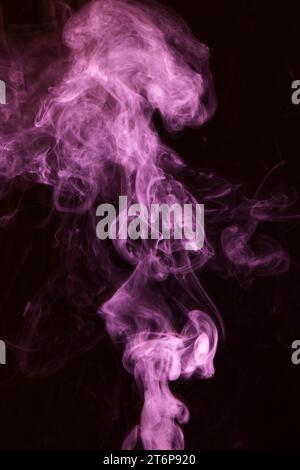 Pink smoke overlay texture movement black background Stock Photo