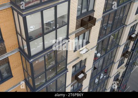 Building exterior with decorative air conditioner covers Stock Photo