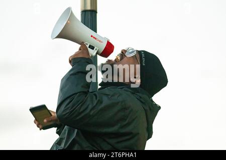 London, UK. 11 November, 2023. A man shouts as 300,000 Palestine supporters march through London to protest against the war in the Middle East Stock Photo