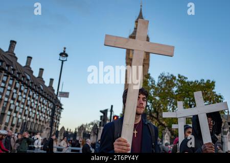 November 11, 2023, London, United Kingdom: Small group of Christians held an anti-abortion rally outside House of Commons. The activists was carrying the icon of Virgin Mary, wooden crosses and placards bearing the images of small babies and human foetus.Under the U.K.'s current laws, surgical abortions are legal up to the 24 week mark and must take place in a clinic. (Credit Image: © Velar Grant/ZUMA Press Wire) EDITORIAL USAGE ONLY! Not for Commercial USAGE! Stock Photo