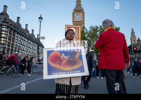 November 11, 2023, London, United Kingdom: Small group of Christians held an anti-abortion rally outside House of Commons. The activists was carrying the icon of Virgin Mary, wooden crosses and placards bearing the images of small babies and human foetus.Under the U.K.'s current laws, surgical abortions are legal up to the 24 week mark and must take place in a clinic. (Credit Image: © Velar Grant/ZUMA Press Wire) EDITORIAL USAGE ONLY! Not for Commercial USAGE! Stock Photo