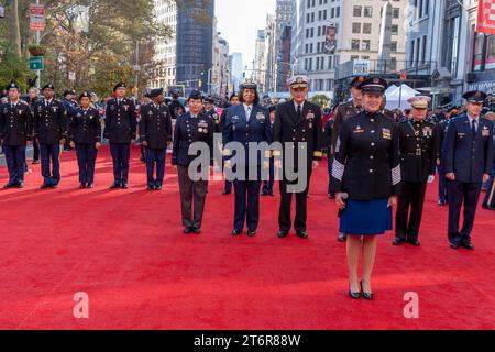 (NEW) Veteran's Day Parade Held In New York City. November 11, 2023, New York, New York, USA: Members of the armed forces stand on the red carpet during opening ceremony of the annual Veterans Day Parade on November 11, 2023 in New York City. Hundreds of people lined 5th Avenue to watch the biggest Veterans Day parade in the United States. This years event included veterans, active soldiers, police officers, firefighters and dozens of school groups participating in the parade which honors the men and women who have served and sacrificed for the country.  (Credit: M10s / TheNews2) Stock Photo