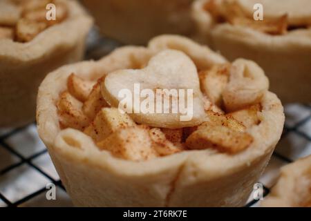 Close up of apple tarts with a heart on top. Stock Photo