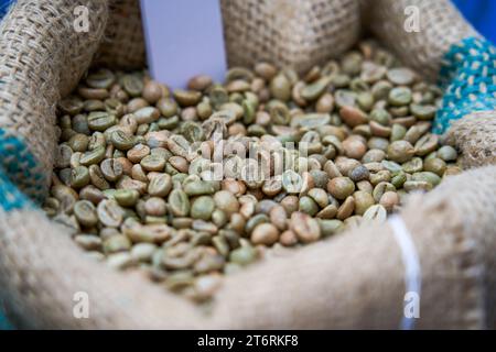 A bag of unroasted green coffee beans close-up Stock Photo