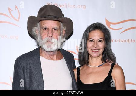 (L-R) Bob Weir and Natascha Muenter Weir attend the 2023 ‘A Funny Thing Happened On The Way To Cure Parkinson’s’ at Casa Cipriani, New York, NY, November 11, 2023. (Photo by Anthony Behar/Sipa USA) Stock Photo