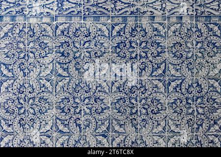 Panel with traditional blue Portuguese azulejos tiles with floral repeating motifs and patterns, decorative wall art, Toledo, Spain. Stock Photo