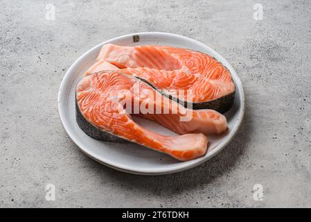 raw salmon on a gray background in a plate. High quality photo Stock Photo