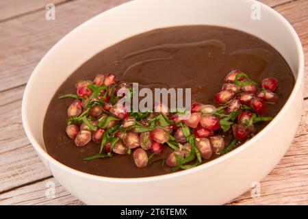 LEBANESE RECIPE, MOUJADARA, LENTIL PUREE, RICE, ONIONS AND POMEGRANATE SEEDS Stock Photo