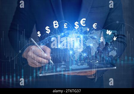 Financial Technology, internet payment, money exchange, digital banking concept. Businessman using digital tablet with hologram world currencies icons Stock Photo