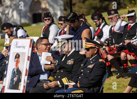 November 11, 2023, Santa Barbara, California, U.S: U.S. Congressman Salud Ortiz Carbajal, who was a Santa Barbara resident and formerly on the SB County Board of Supervisors, is next to the poster remembering Command Sergeant Major Jonathan Church, US Army. They are at the annual Veteranâ€™s Day Ceremony at Santa Barbara Cemetery, â€œHonoring all who have servedâ€, hosted by Pierre Claeyssenâ€™s Veterans Foundation. (Credit Image: © Amy Katz/ZUMA Press Wire) EDITORIAL USAGE ONLY! Not for Commercial USAGE! Stock Photo