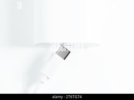Charger and USB Type-C cable on white background Stock Photo