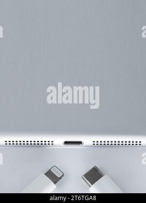 Smartphone or Iphone Connects to Charger through USB Cable, Top View. Stock Photo