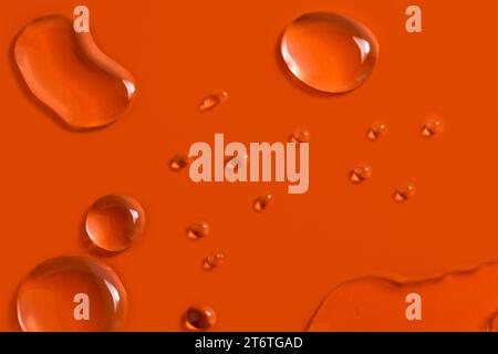 Water drops on orange background Stock Photo