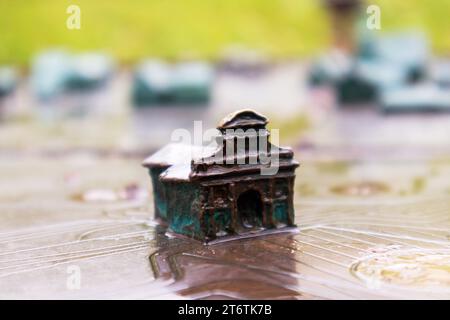 A small house cast in bronze as a decorative element Stock Photo