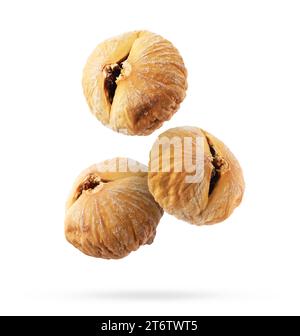 Dried figs falling on white background. Exotic fruit Stock Photo