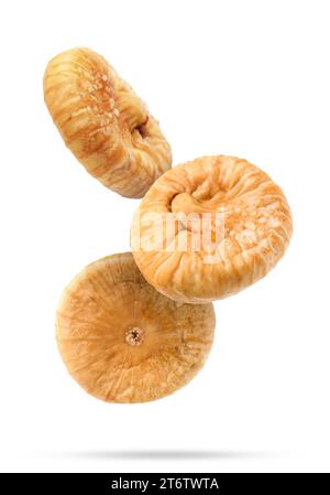 Dried figs falling on white background. Exotic fruit Stock Photo