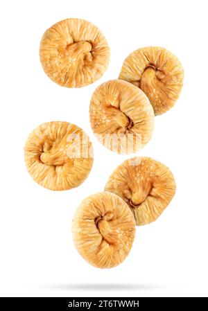 Many dried figs falling on white background Stock Photo