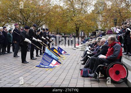 Standards are lowered during a Remembrance Sunday service at the Cenotaph in Guildhall Square, Portsmouth. Picture date: Sunday November 12, 2023. Stock Photo