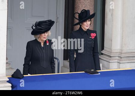 Queen Camilla (left) and the Princess of Wales stand on a balcony at the Foreign, Commonwealth and Development Office (FCDO) on Whitehall during the Remembrance Sunday service at the Cenotaph, in Whitehall, London. Picture date: Sunday November 12, 2023. Stock Photo