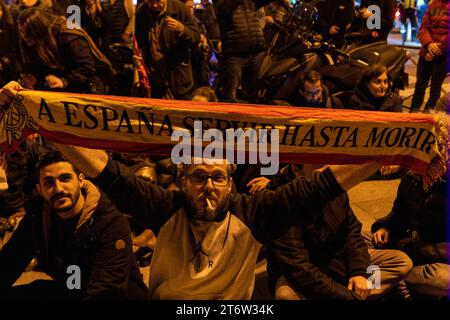 A protestant holds a banner that says 'Spain will serve until we die' during the demonstration. Concentration and attempted camping took place in front of the Congress of Deputies in Madrid under the slogan ¨Let's put limits and control on politicians¨, organized by ¨La Junta Democrática¨, a civil organization that coordinates and promotes the unitary action of the Spanish people. The goal is to establish freely and peacefully in Spain a democratic regime with a separation of powers from the outset and the direct election of political representatives. (Photo by Guillermo Gutierrez Carrascal / Stock Photo