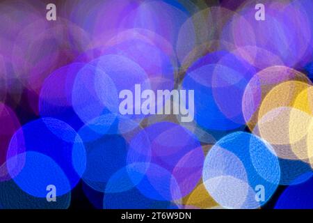 Bokeh of multi-colored New Year's lights at night. Background image. New Year's lights Stock Photo
