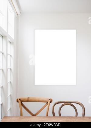 Mockup rectangle picture frame. Abstract empty white artist painting in bright vintage dining or living room near window. Blank frame hanging on white Stock Photo