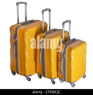 A set of yellow suitcases on wheels. Baggage. Travel suitcase isolated on white background. Stock Photo