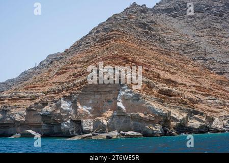 Arid and rocky landscape in the touristic Fjords of Musandam Peninsula near Khasab, Sultanate of Oman, a travel gem in the Middle East Stock Photo