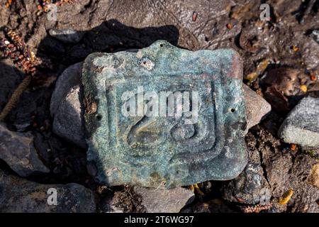 Old hammered copper door plate, green from oxidation, with the number twenty-three 23 Stock Photo