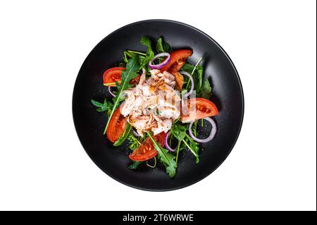 Salad with roasted salmon fillet steak, fresh salad arugula and tomato in a plate. Isolated, white background. Top view Stock Photo
