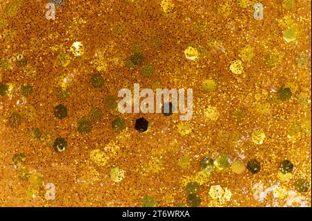 Pattern of gold color slime background macro close up view Stock Photo