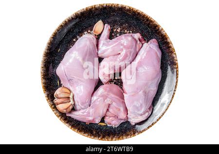 Raw fresh rabbit legs on a plate with herbs. Isolated, white background. Top view Stock Photo