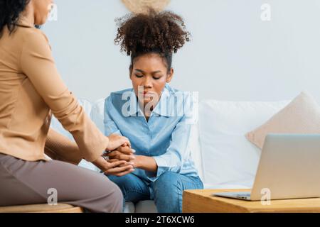 Close up shot of supportive and comforting hands for cheering up depressed patient person or stressed mind with crucial empathy Stock Photo