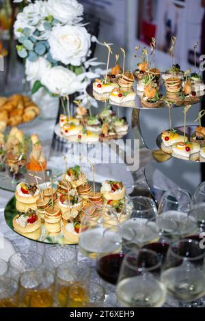 top view of various canapes on the buffet table. Stock Photo