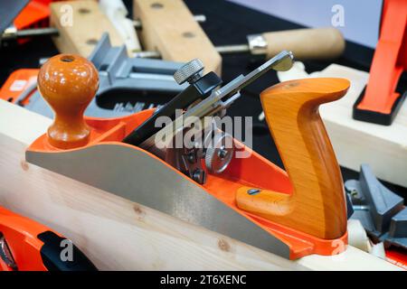 Carpenter's wood plane and other woodworking tools close up with foreground focus Stock Photo