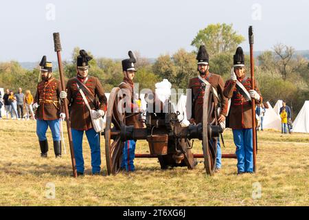 Hungarian traditionalists fire a cannon during a historical battle reenactment. Pakozd, Hungary - September 30. 2023. Stock Photo