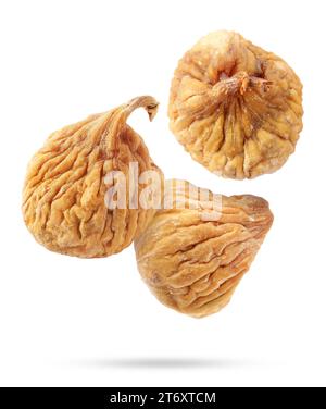 Dried figs falling on white background. Exotic fruit Stock Photo