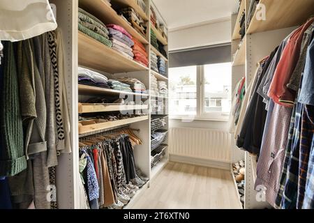 Walk in wardrobe with clothes and shoes hi-res stock photography and images  - Alamy