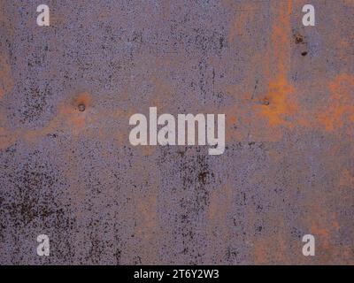 Grunge, rusty surface of metal sheet. Brown and metallic blue colors. Stock Photo
