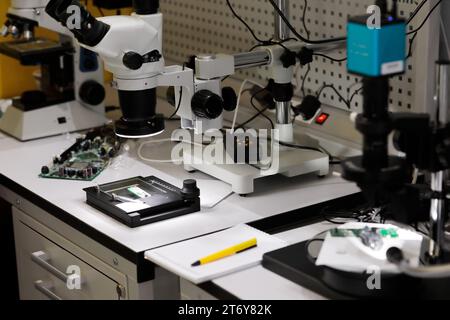 Printed circuit board quality control laboratory. Selective focus. Stock Photo