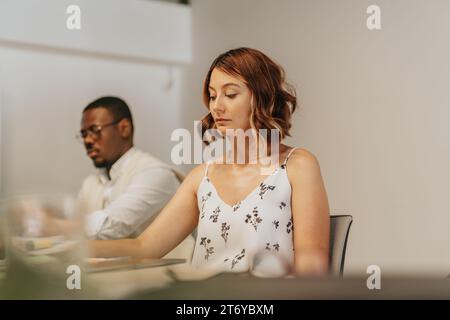 Multigenerational Business Team Analyzing Sales and Profit Growth at Table Stock Photo