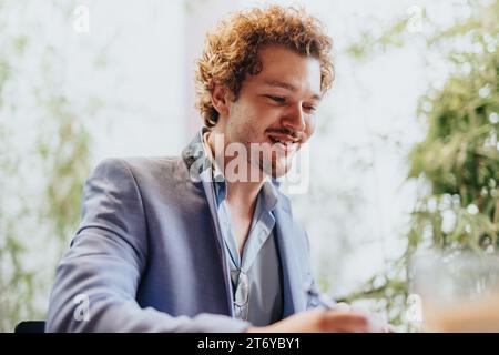 Professionals discuss innovative architectural project. Design, finances, teamwork, sustainable construction. Smiling faces, collaborative workplace. Stock Photo